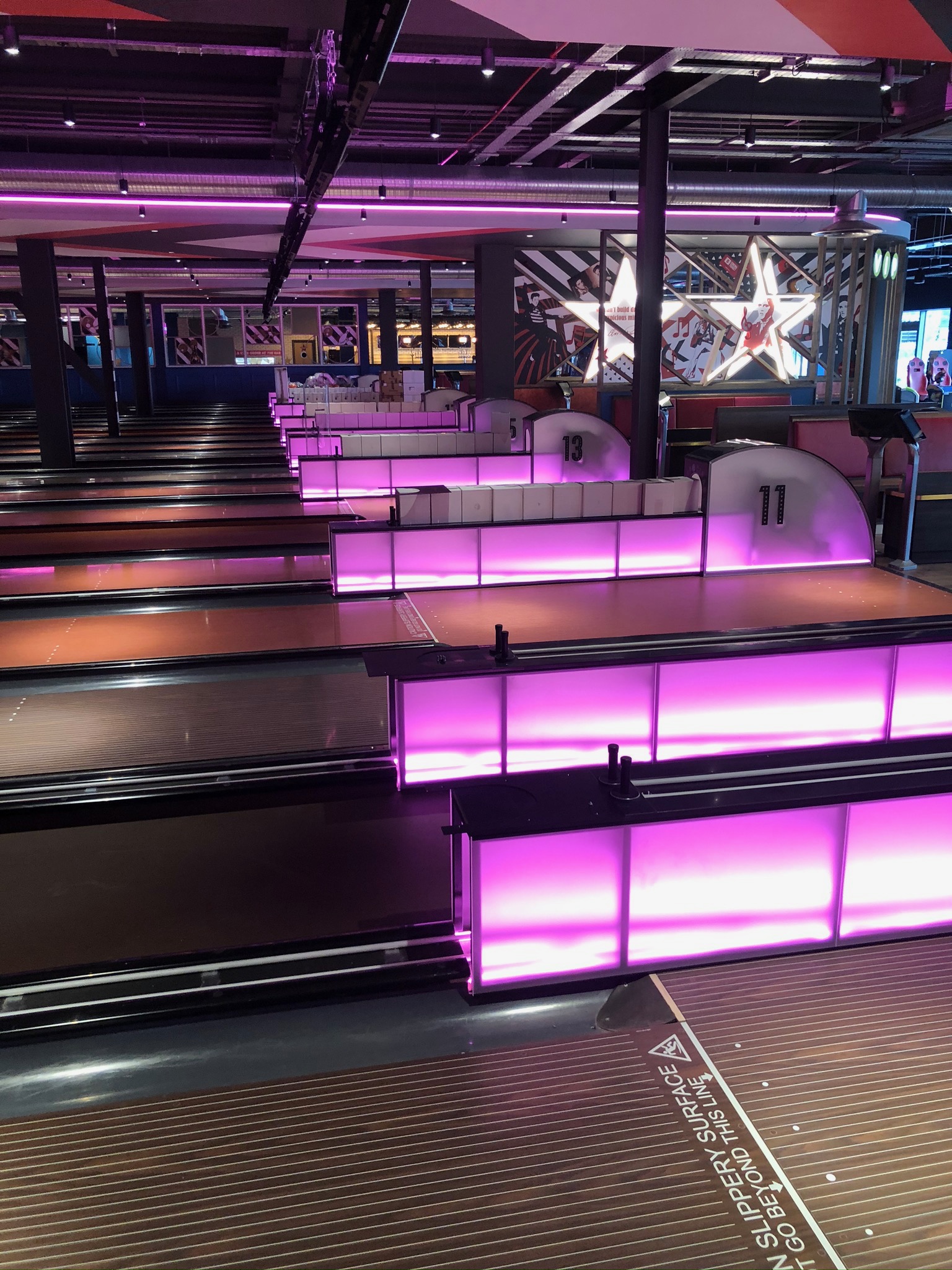 Hollywood Bowl York bowling lanes with purple LED ball returns and star graphics